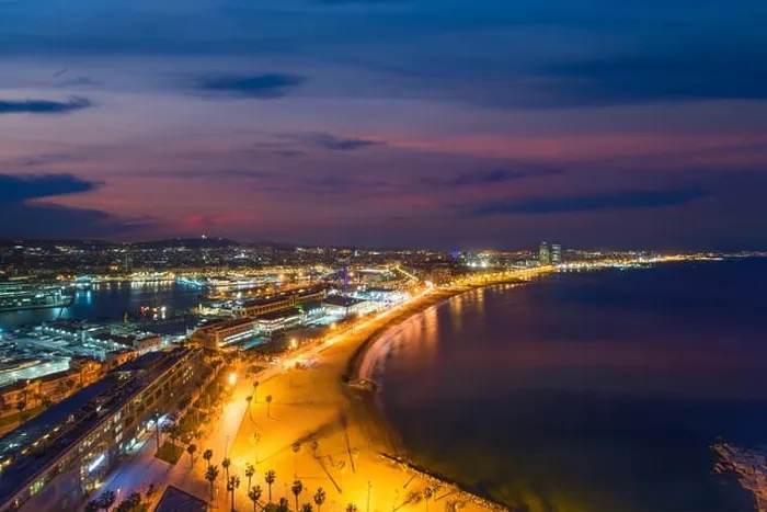 Framed Print : Aerial view of Barcelona Beach in summer night along seaside in Barcelona, Spain. Mediterranean Sea in Spain Framed Print : Aerial view of Barcelona Beach in summer night along seaside in Barcelona, Spain. Mediterranean Sea in Spain