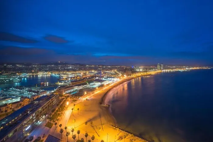 Framed Print : Aerial view of Barcelona Beach in summer night along seaside in Barcelona, Spain. Mediterranean Sea in Spain Framed Print : Aerial view of Barcelona Beach in summer night along seaside in Barcelona, Spain. Mediterranean Sea in Spain