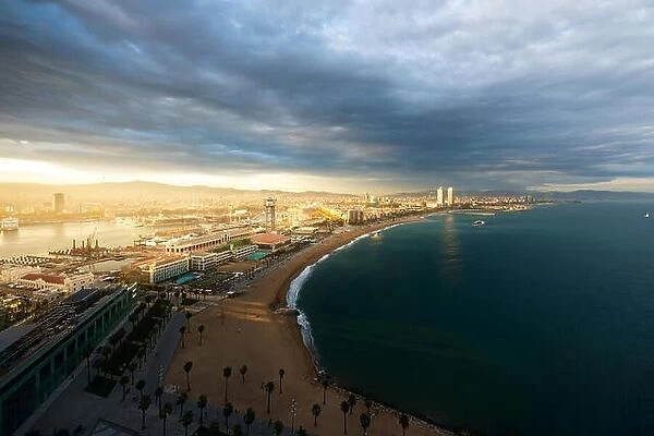 Aerial view of Barcelona Beach during sunset along seaside in Barcelona, Spain. Mediterranean Sea in Spain
