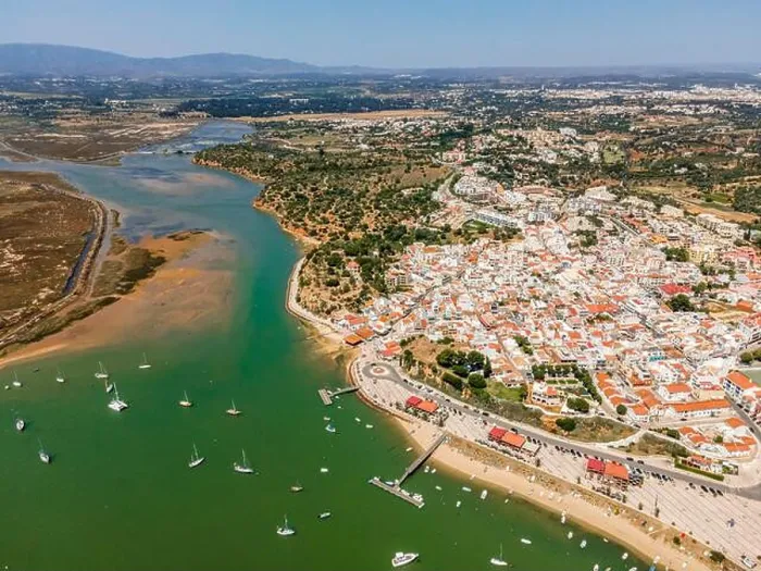 Framed Print : Aerial view, bay with yachts and view of coastal town Alvor, Algarve, Portugal Framed Print : Aerial view, bay with yachts and view of coastal town Alvor, Algarve, Portugal