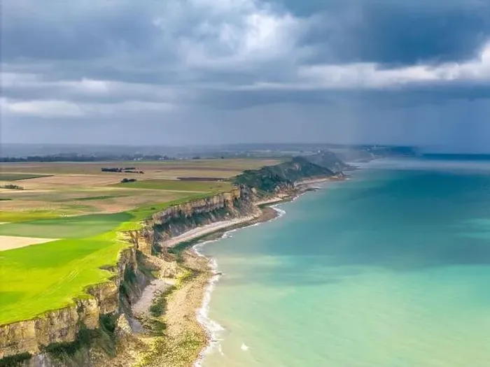 Framed Print : Aerial view of the beautiful coastline near Arromanches in Normandy, France. High cliffs rise above the sea