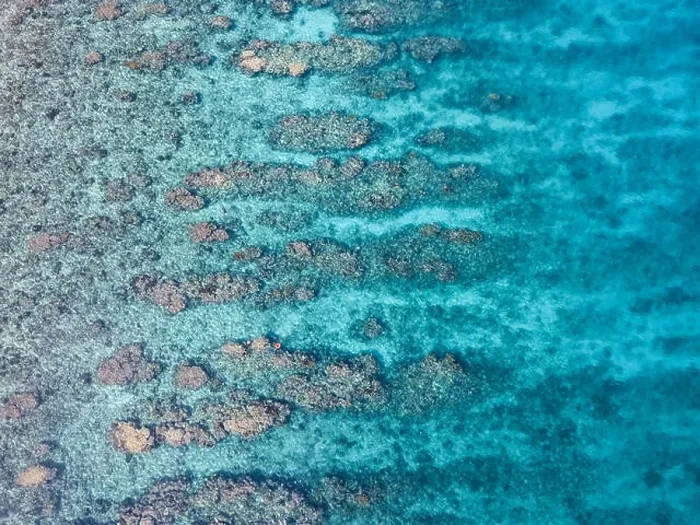 Framed Print : An aerial view of a beautiful coral reef on the edge of Turneffe Atoll off the coast of Belize. This area of the Caribbean is extremely biodiverse Framed Print : An aerial view of a beautiful coral reef on the edge of Turneffe Atoll off the coast of Belize. This area of the Caribbean is extremely biodiverse