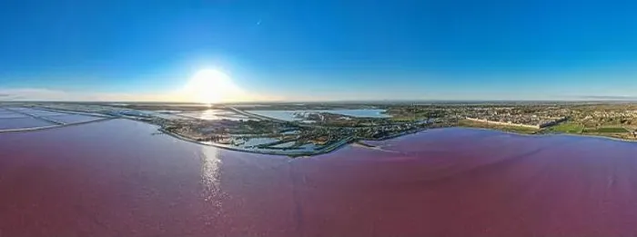 Framed Print : Aerial view of the beautiful pink lake and salt production of the Camargue in front of the village of Aigues Mortes Framed Print : Aerial view of the beautiful pink lake and salt production of the Camargue in front of the village of Aigues Mortes