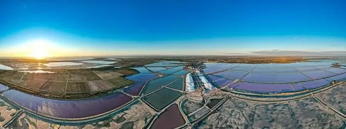 Framed Print : Aerial view of the beautiful pink lake and salt production of the Camargue in front of the village of Aigues Mortes Framed Print : Aerial view of the beautiful pink lake and salt production of the Camargue in front of the village of Aigues Mortes
