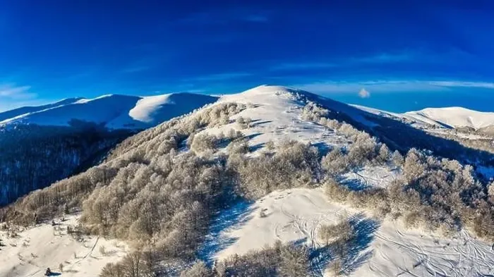 Framed Print : Aerial view of beautiful winter mountain slopes Framed Print : Aerial view of beautiful winter mountain slopes