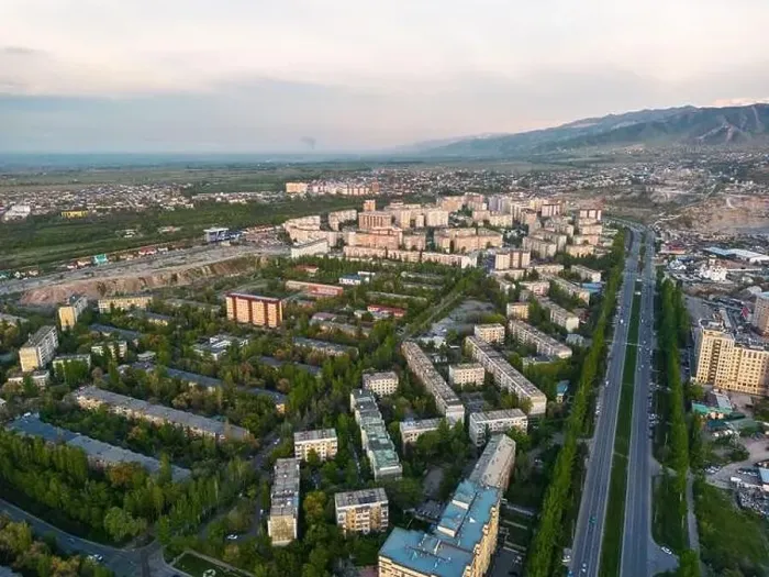 Framed Print : Aerial view of Bishkek city Kyrgyzstan with snowy mountains in the background Framed Print : Aerial view of Bishkek city Kyrgyzstan with snowy mountains in the background