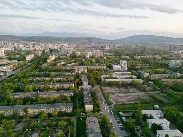 Framed Print : Aerial view of Bishkek city Kyrgyzstan with snowy mountains in the background Framed Print : Aerial view of Bishkek city Kyrgyzstan with snowy mountains in the background