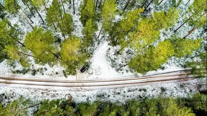 Framed Print : Aerial View Of Black Car On Snow Covered forest road Framed Print : Aerial View Of Black Car On Snow Covered forest road