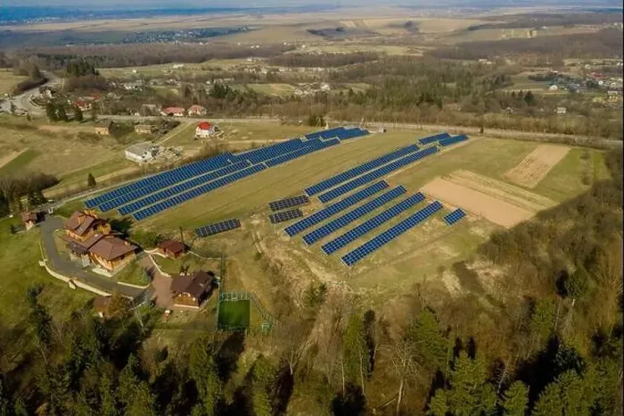 Framed Print : Aerial view of blue solar photo voltaic panels system producing renewable clean energy on rural landscape Framed Print : Aerial view of blue solar photo voltaic panels system producing renewable clean energy on rural landscape