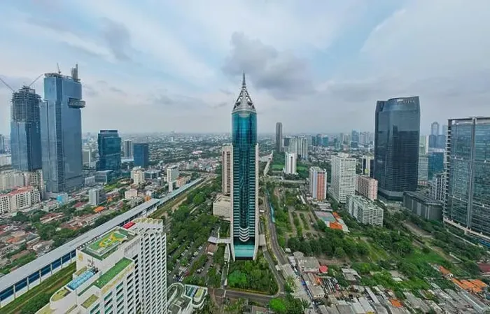 Framed Print : Aerial view of BNI 46 building in Jakarta and noise cloud with cityscape Framed Print : Aerial view of BNI 46 building in Jakarta and noise cloud with cityscape