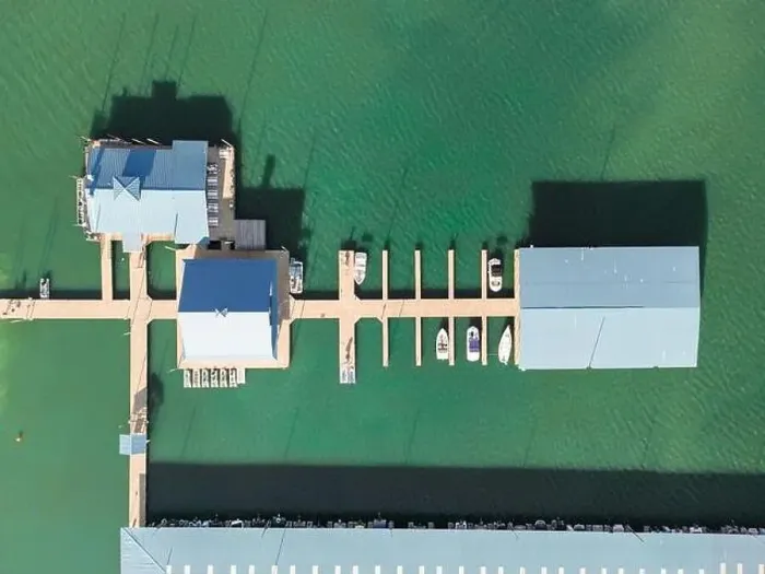 Framed Print : Aerial top down view of boat dock and yacht port, boats are moored on sea. Yacht club boats parking. Photo from drone