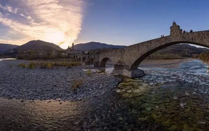 Framed Print : Aerial view of Bobbio town and Gobbo Bridge of Devil at sunset. Trebbia Valley, Emilia Romagna, Piacenza, Italy Framed Print : Aerial view of Bobbio town and Gobbo Bridge of Devil at sunset. Trebbia Valley, Emilia Romagna, Piacenza, Italy