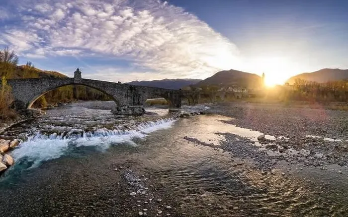 Framed Print : Aerial view of Bobbio town and Gobbo Bridge of Devil at sunset. Trebbia Valley, Emilia Romagna, Piacenza, Italy Framed Print : Aerial view of Bobbio town and Gobbo Bridge of Devil at sunset. Trebbia Valley, Emilia Romagna, Piacenza, Italy