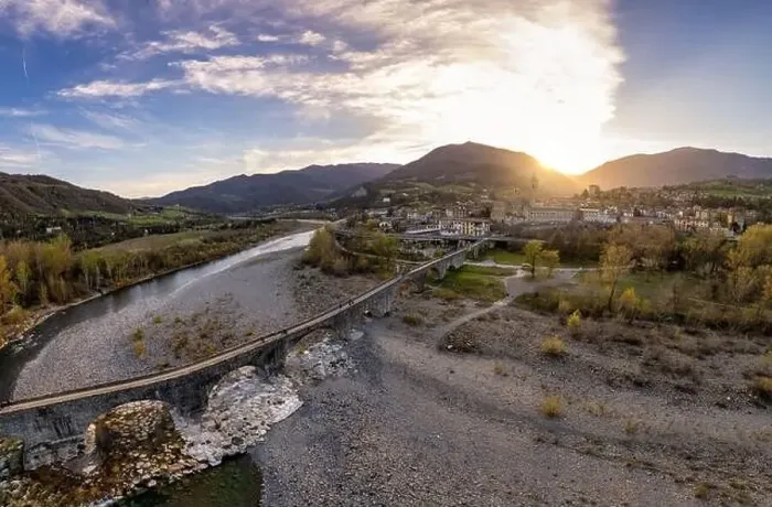 Framed Print : Aerial view of Bobbio town and Gobbo Bridge of Devil at sunset. Trebbia Valley, Emilia Romagna, Piacenza, Italy Framed Print : Aerial view of Bobbio town and Gobbo Bridge of Devil at sunset. Trebbia Valley, Emilia Romagna, Piacenza, Italy
