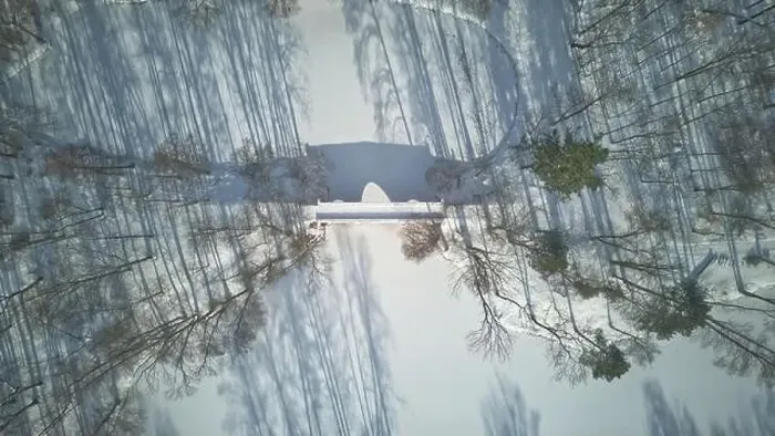 Framed Print : Aerial view of the bridge in the park, frozen pond, long shadow of trees, beautiful winter scenery Framed Print : Aerial view of the bridge in the park, frozen pond, long shadow of trees, beautiful winter scenery