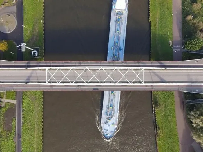 Framed Print : Aerial view of a bridge over a river with a water way river running underneath Framed Print : Aerial view of a bridge over a river with a water way river running underneath