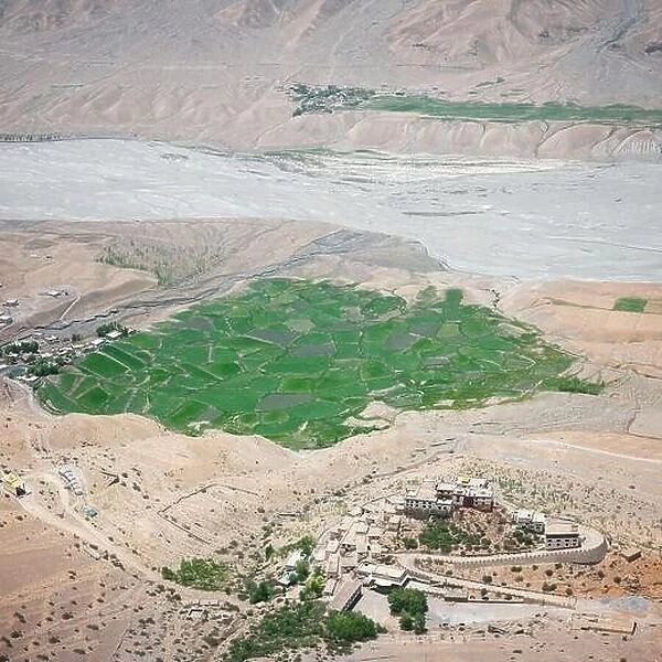 Aerial view of Buddhist temple monastery Key (Ki Gompa) on a high cliff overlooking the confluence of Pin Rivers