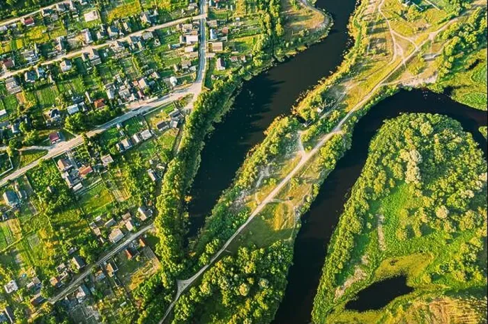 Framed Print : Aerial View Of Calm River And Village In Belarus, Europe. Green Forest Woods Landscape In Sunny Summer Evening. Top View Of Beautiful European Nature Framed Print : Aerial View Of Calm River And Village In Belarus, Europe. Green Forest Woods Landscape In Sunny Summer Evening. Top View Of Beautiful European Nature