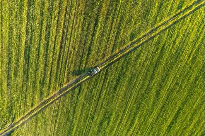 Framed Print : Aerial view of car SUV parked near countryside road in field rural landscape. Bird's-eye drone view of car SUV parked near countryside road in summer Framed Print : Aerial view of car SUV parked near countryside road in field rural landscape. Bird's-eye drone view of car SUV parked near countryside road in summer