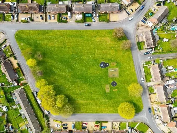 Framed Print : Aerial top down view of a centre green space area and small playground Framed Print : Aerial top down view of a centre green space area and small playground