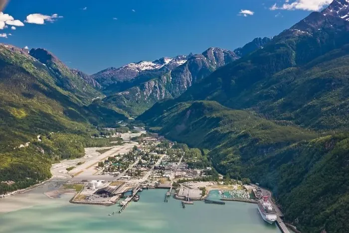 Framed Print : Aerial view of the city of Skagway with a cruise ship docked at port, Southeast Alaska, Summer Framed Print : Aerial view of the city of Skagway with a cruise ship docked at port, Southeast Alaska, Summer