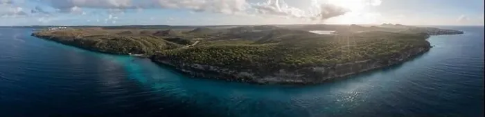 Framed Print : Aerial view of coast scenery with the ocean, cliff, and beach around Vaersenbaai area, Curacao, Caribbean Framed Print : Aerial view of coast scenery with the ocean, cliff, and beach around Vaersenbaai area, Curacao, Caribbean