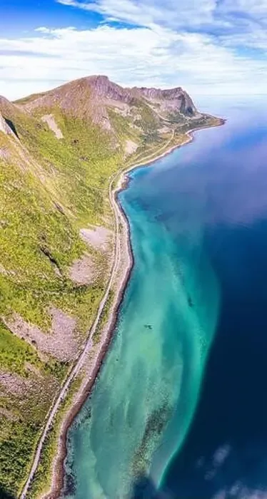 Framed Print : Aerial view of coastal road nearby the crystal sea at feet of Husfjellet mountain Framed Print : Aerial view of coastal road nearby the crystal sea at feet of Husfjellet mountain