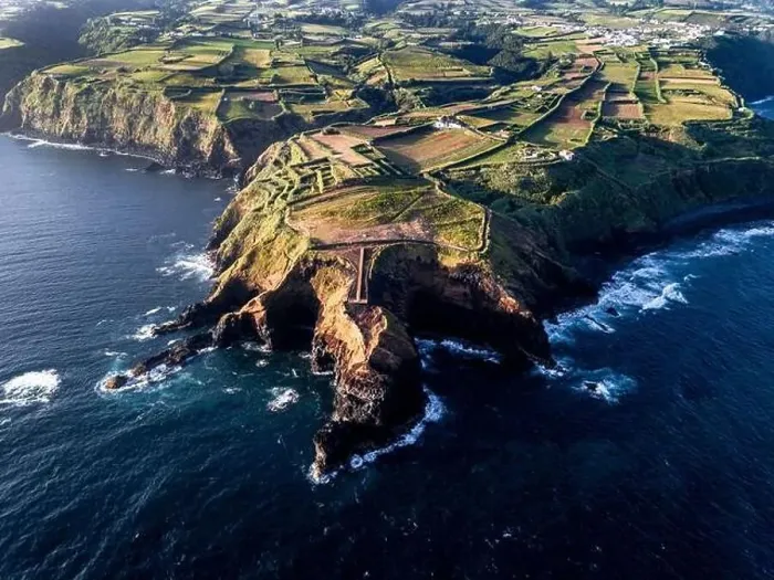 Framed Print : Aerial view of the coasts and cliffs of the island of Sao Miguel over the lighthouse of Farolim dos Fenais da Ajuda Framed Print : Aerial view of the coasts and cliffs of the island of Sao Miguel over the lighthouse of Farolim dos Fenais da Ajuda