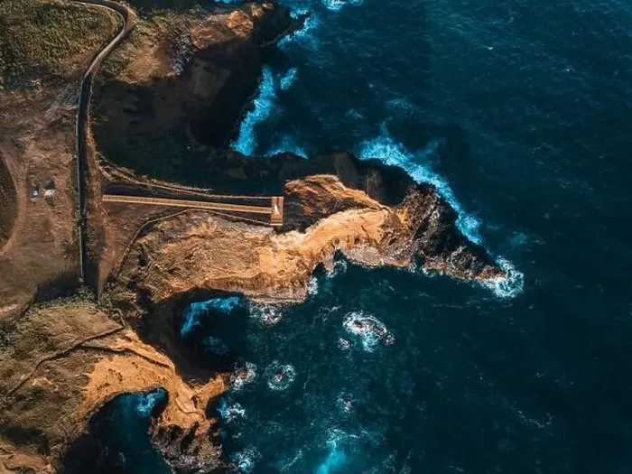 Framed Print : Aerial view of the coasts and cliffs of the island of Sao Miguel over the lighthouse of Farolim dos Fenais da Ajuda Framed Print : Aerial view of the coasts and cliffs of the island of Sao Miguel over the lighthouse of Farolim dos Fenais da Ajuda