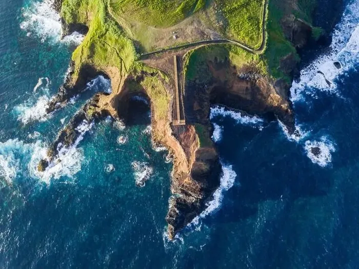 Framed Print : Aerial view of the coasts and cliffs of the island of Sao Miguel over the lighthouse of Farolim dos Fenais da Ajuda Framed Print : Aerial view of the coasts and cliffs of the island of Sao Miguel over the lighthouse of Farolim dos Fenais da Ajuda