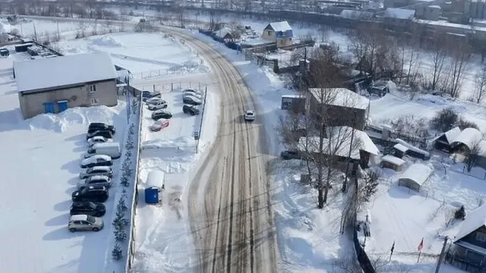 Framed Print : Aerial view of a countryside rural road covered by snow. Clip. Flying above rural road and a village Framed Print : Aerial view of a countryside rural road covered by snow. Clip. Flying above rural road and a village