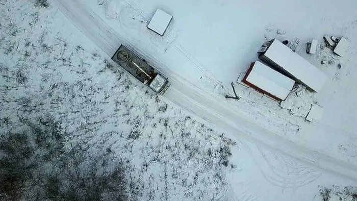 Framed Print : Aerial view of a countryside rural road covered by snow. Clip. Flying above rural road and a village Framed Print : Aerial view of a countryside rural road covered by snow. Clip. Flying above rural road and a village