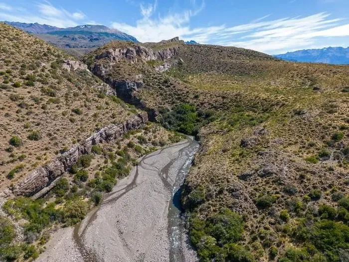 Framed Print : Aerial view of a creek running through the gorge of Quebrada El Diablo in Chile - Traveling on the Carretera Austral Framed Print : Aerial view of a creek running through the gorge of Quebrada El Diablo in Chile - Traveling on the Carretera Austral