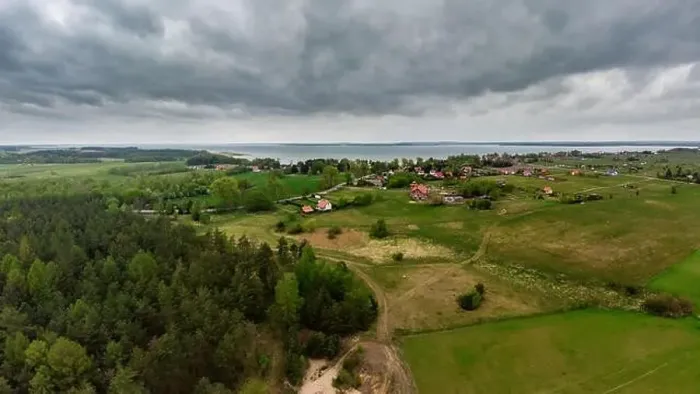 Framed Print : Aerial view of dark moody sky above Nowe Guty village and Sniardwy lake Framed Print : Aerial view of dark moody sky above Nowe Guty village and Sniardwy lake