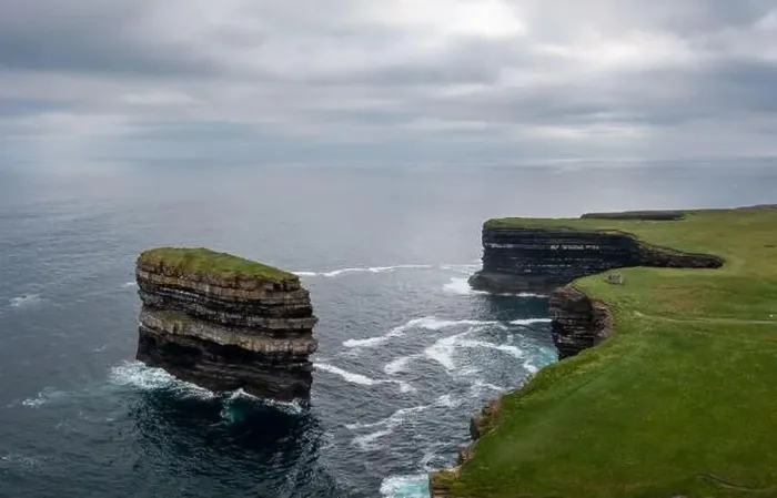 Framed Print : Aerial view of the Downpatrick Head sea stack and cliffs and coastline of northern County Mayo in Ireland