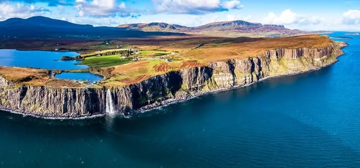 Framed Print : Aerial view of the dramatic coastline at the cliffs by Staffin with the famous Kilt Rock waterfall - Isle of Skye Framed Print : Aerial view of the dramatic coastline at the cliffs by Staffin with the famous Kilt Rock waterfall - Isle of Skye