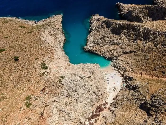 Framed Print : Aerial top view by drone of beach of Seitan Limania in bay with turquoise water and an unusual shape in Akrotiri, Crete Framed Print : Aerial top view by drone of beach of Seitan Limania in bay with turquoise water and an unusual shape in Akrotiri, Crete