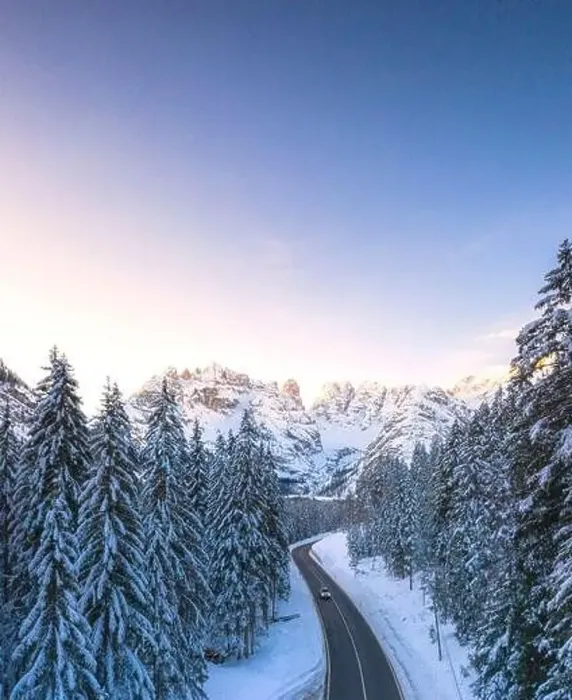 Framed Print : Aerial view by drone of car traveling on the scenic road Dobbiaco-Misurina along snowy woods at dawn Framed Print : Aerial view by drone of car traveling on the scenic road Dobbiaco-Misurina along snowy woods at dawn
