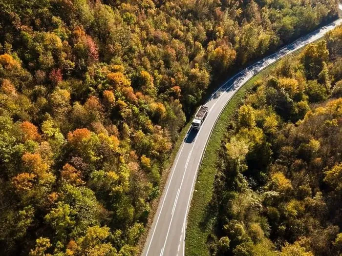 Framed Print : Aerial view drone image on the road trough the trees Framed Print : Aerial view drone image on the road trough the trees
