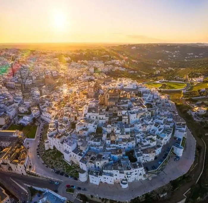 Framed Print : Aerial view by drone of the old town of Ostuni at sunset, Apulia, Italy, Europe Framed Print : Aerial view by drone of the old town of Ostuni at sunset, Apulia, Italy, Europe