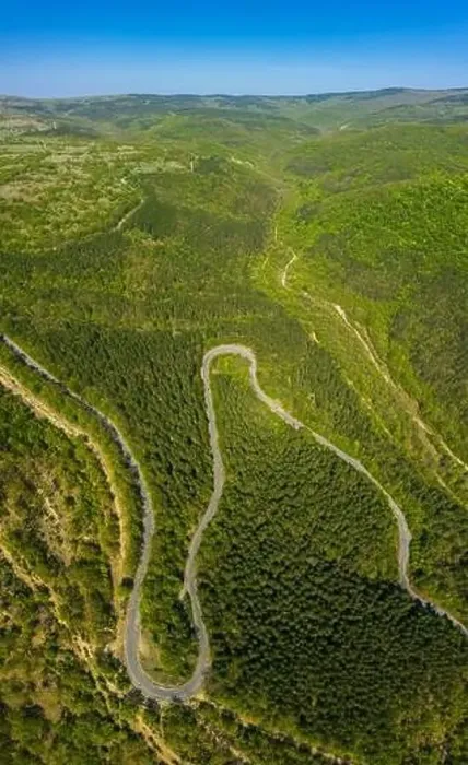 Framed Print : Aerial view from drone to the road through mountain Framed Print : Aerial view from drone to the road through mountain