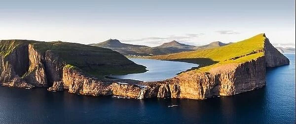 Aerial view from drone of Sorvagsvatn lake on cliffs of Vagar island in sunset time, Faroe Islands, Denmark. Landscape photography