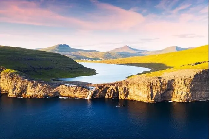 Framed Print : Aerial view from drone of Sorvagsvatn lake on cliffs of Vagar island in sunset time, Faroe Islands, Denmark. Landscape photography Framed Print : Aerial view from drone of Sorvagsvatn lake on cliffs of Vagar island in sunset time, Faroe Islands, Denmark. Landscape photography
