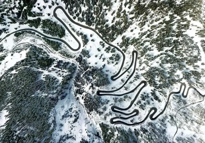 Framed Print : Aerial view by drone on the most spectacular pass road in Swiss Alps - Maloja Pass in Grison, Switzerland Framed Print : Aerial view by drone on the most spectacular pass road in Swiss Alps - Maloja Pass in Grison, Switzerland