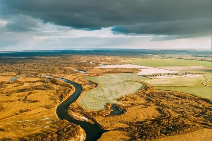 Framed Print : Aerial View Of Dry Grass And Partly Frozen River Landscape In Late Autumn Day. High Attitude View. Marsh Bog. Drone View. Bird's Eye View
