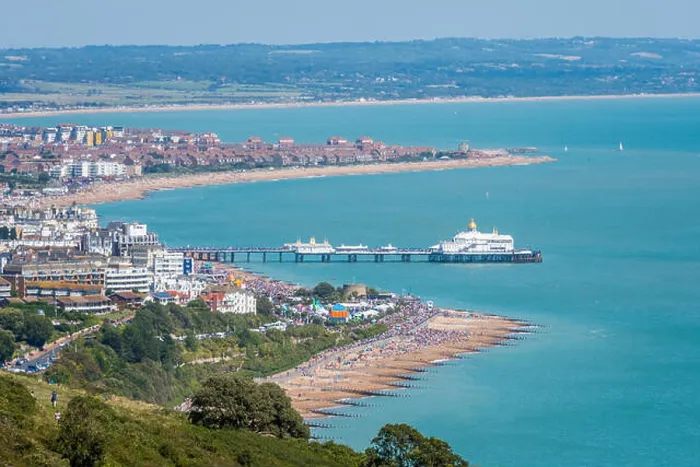Framed Print : Aerial view of Eastbourne seafront, promenade, pier and English Channel from Beachy Head cliff top footpath Framed Print : Aerial view of Eastbourne seafront, promenade, pier and English Channel from Beachy Head cliff top footpath