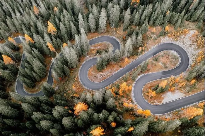 Framed Print : Top aerial view of famous Snake road near Passo Giau in Dolomite Alps. Winding mountains road in lush forest with orange larch trees Framed Print : Top aerial view of famous Snake road near Passo Giau in Dolomite Alps. Winding mountains road in lush forest with orange larch trees