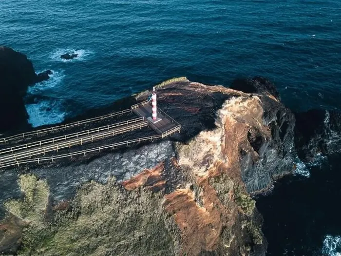 Framed Print : Aerial view of Farolim dos Fenais da Ajuda lighthouse on a cliff Framed Print : Aerial view of Farolim dos Fenais da Ajuda lighthouse on a cliff