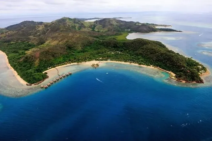 Framed Print : aerial view of a fiji resort on the ocean with island in the background Framed Print : aerial view of a fiji resort on the ocean with island in the background