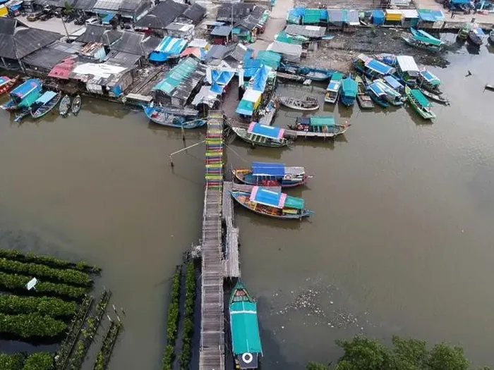 Framed Print : Aerial view of fisherman village and mangrove forest in rainy season. Bekasi, Indonesia, March 9, 2021 Framed Print : Aerial view of fisherman village and mangrove forest in rainy season. Bekasi, Indonesia, March 9, 2021
